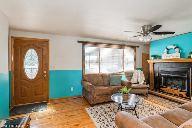 31 Medinah Ave, Fox Lake, IL 60020 - living room with wood finished floors, ceiling fan, and a tiled fireplace