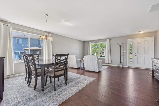 707 Brighton Dr, Pingree Grove, IL 60140 - dining room with a chandelier and dark wood-type flooring