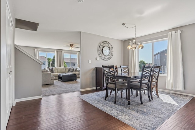 707 Brighton Dr, Pingree Grove, IL 60140 - dining room featuring plenty of natural light, dark wood-type flooring, a chandelier, and a ceiling fan