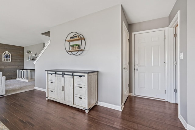 707 Brighton Dr, Pingree Grove, IL 60140 - entryway featuring dark wood-type flooring and wooden walls