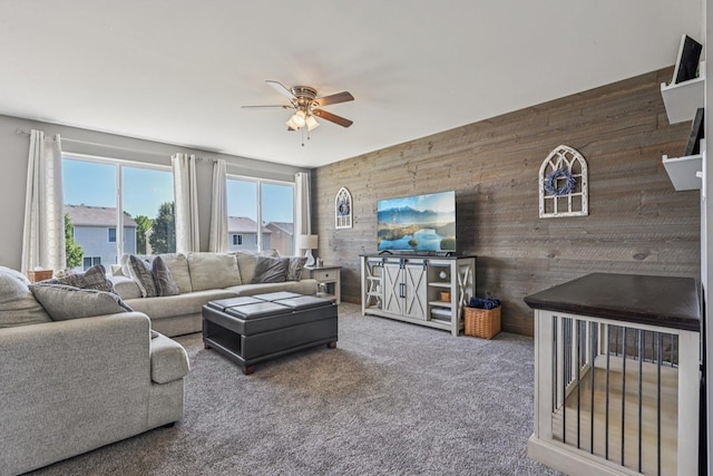 707 Brighton Dr, Pingree Grove, IL 60140 - living area with wood walls, a ceiling fan, and carpet floors