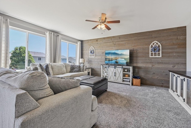 707 Brighton Dr, Pingree Grove, IL 60140 - living area featuring wooden walls, a ceiling fan, and carpet flooring
