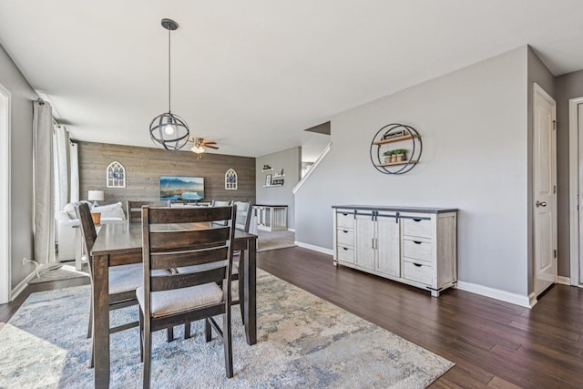 707 Brighton Dr, Pingree Grove, IL 60140 - dining room featuring wood walls, a ceiling fan, and dark wood-style floors