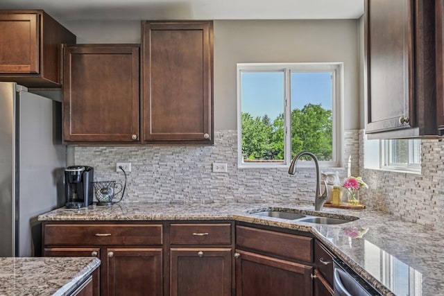 707 Brighton Dr, Pingree Grove, IL 60140 - kitchen featuring appliances with stainless steel finishes, backsplash, plenty of natural light, and dark brown cabinetry