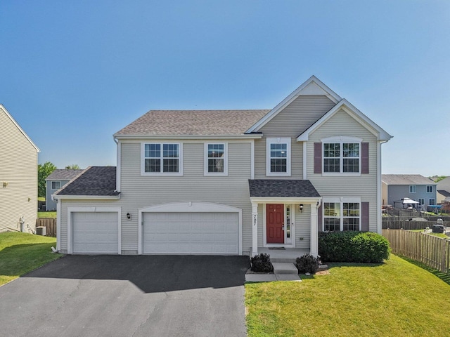 707 Brighton Dr, Pingree Grove, IL 60140 - traditional-style house featuring asphalt driveway, a shingled roof, and an attached garage