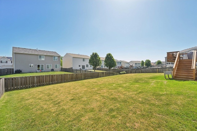 707 Brighton Dr, Pingree Grove, IL 60140 - fenced backyard with a residential view, stairs, and a deck