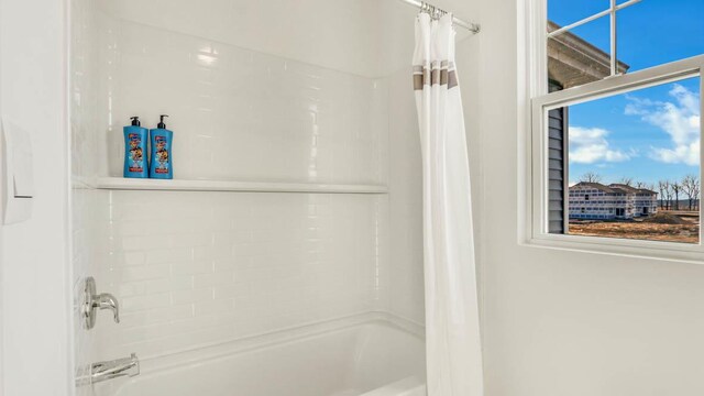 5025 Yates Dr, Mount Pleasant, WI 53403 - bathroom featuring shower / bath combo