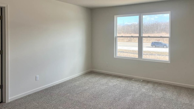 5025 Yates Dr, Mount Pleasant, WI 53403 - empty room with carpet and baseboards