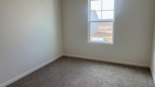 5025 Yates Dr, Mount Pleasant, WI 53403 - carpeted spare room with baseboards