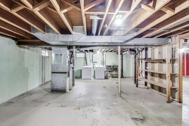 915 Carol Ave, Elgin, IL 60123 - basement with washing machine and clothes dryer, heating unit, and electric panel