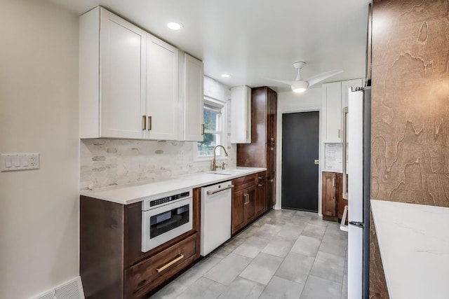 915 Carol Ave, Elgin, IL 60123 - kitchen with white appliances, white cabinetry, backsplash, ceiling fan, and recessed lighting