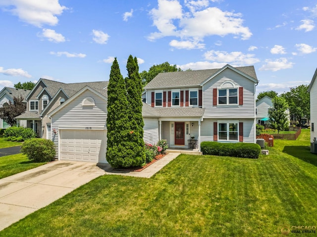 1878 Grassy Knoll Ct, Romeoville, IL 60446 - view of front of home featuring driveway, an attached garage, and a front lawn