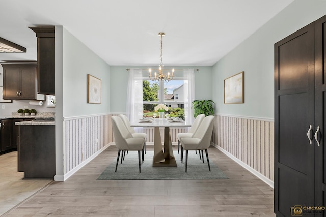 1878 Grassy Knoll Ct, Romeoville, IL 60446 - dining room with wainscoting, a chandelier, light wood-style floors, and wallpapered walls