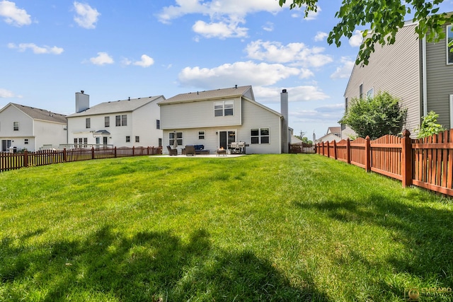 1878 Grassy Knoll Ct, Romeoville, IL 60446 - rear view of house featuring a patio area, a fenced backyard, and a chimney
