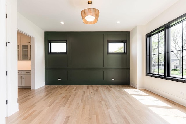 425 Sherman St, Downers Grove, IL 60515 - unfurnished room featuring light wood finished floors, a decorative wall, and recessed lighting