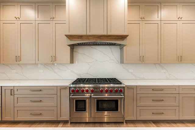 425 Sherman St, Downers Grove, IL 60515 - kitchen featuring double oven range, custom range hood, decorative backsplash, light stone counters, and gray cabinets