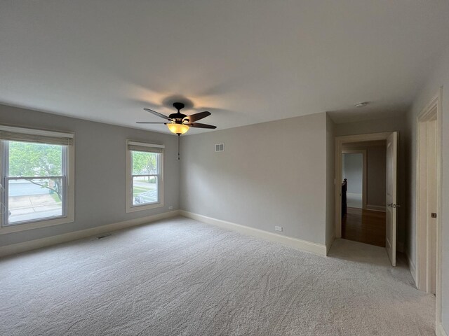 1108 N Devonshire Rd, Buffalo Grove, IL 60089 - empty room with light colored carpet and a ceiling fan