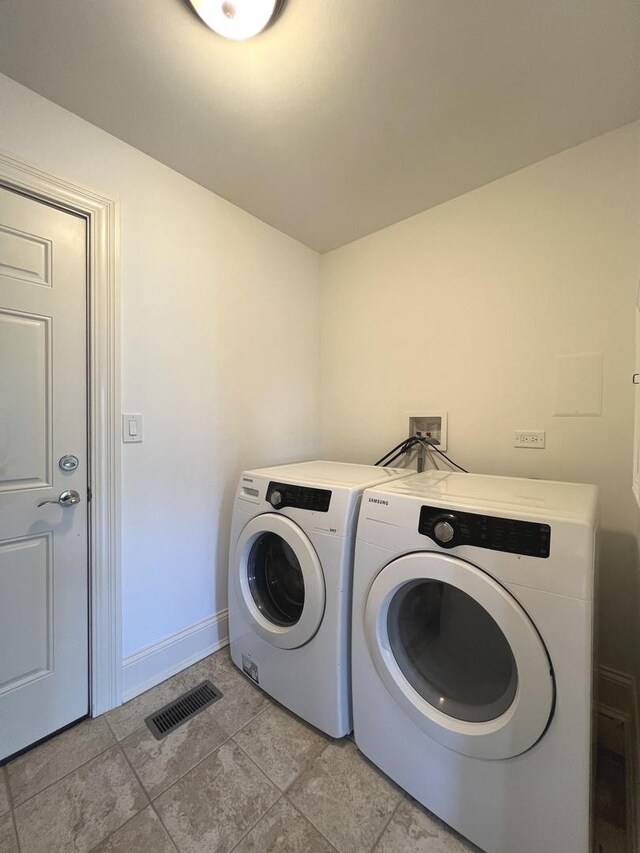 1108 N Devonshire Rd, Buffalo Grove, IL 60089 - laundry area with independent washer and dryer and light tile patterned flooring