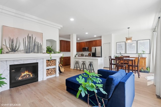 5530 Cambridge Way, Hanover Park, IL 60133 - living room featuring light wood-style flooring, a high end fireplace, and recessed lighting