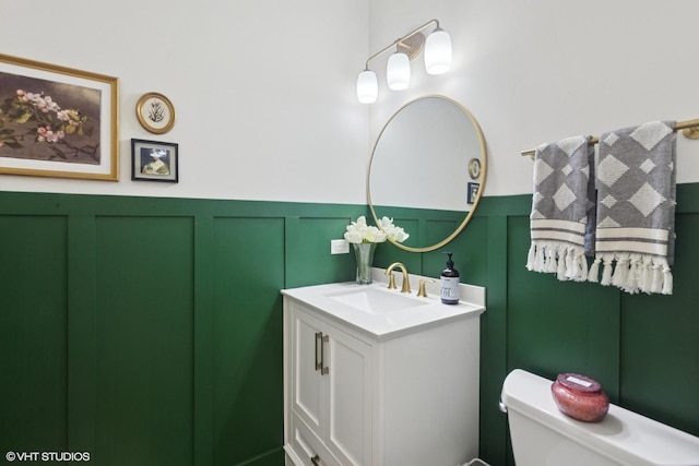 5530 Cambridge Way, Hanover Park, IL 60133 - bathroom with a decorative wall, vanity, and a wainscoted wall