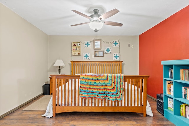 6422 Steward Rd, Rockford, IL 61101 - bedroom with wood finished floors, a nursery area, and a ceiling fan