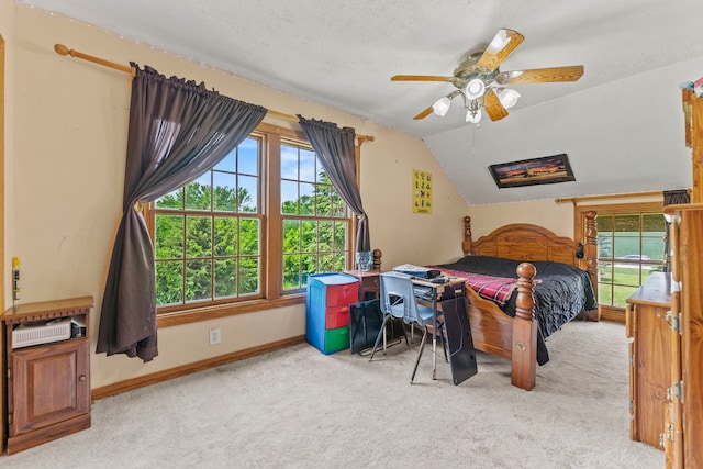 6422 Steward Rd, Rockford, IL 61101 - carpeted bedroom featuring multiple windows, lofted ceiling, and a ceiling fan