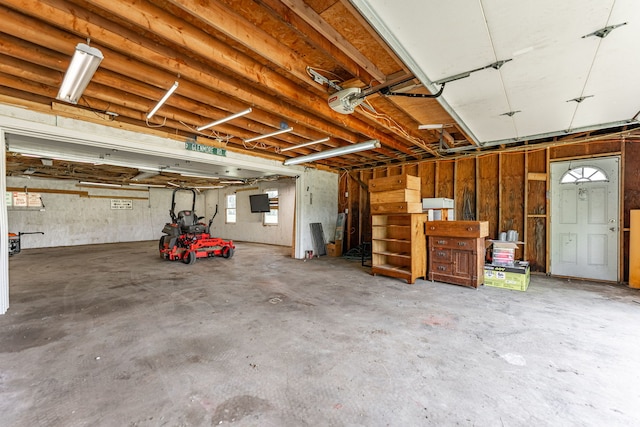6422 Steward Rd, Rockford, IL 61101 - garage featuring a garage door opener