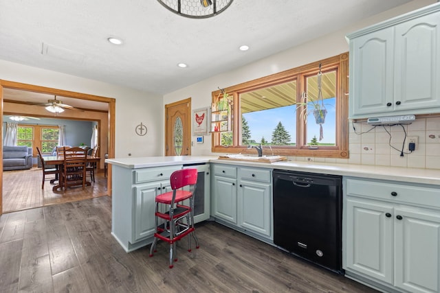 6422 Steward Rd, Rockford, IL 61101 - kitchen featuring dishwasher, a peninsula, recessed lighting, dark wood-type flooring, and tasteful backsplash