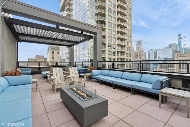 247 E Chestnut St Unit 2504, Chicago, IL 60611 - view of patio / terrace with an outdoor living space with a fire pit, a view of skyline, and cooling unit