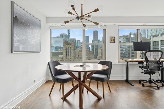 247 E Chestnut St Unit 2504, Chicago, IL 60611 - dining space featuring a chandelier and wood finished floors
