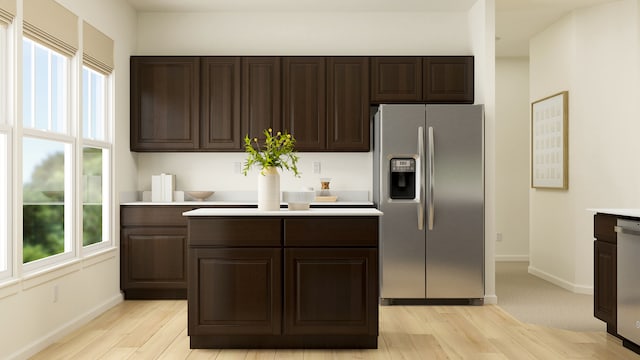 2109 Neubauer Cir, Lindenhurst, IL 60046 - kitchen with appliances with stainless steel finishes, dark brown cabinetry, light wood-style floors, and light countertops