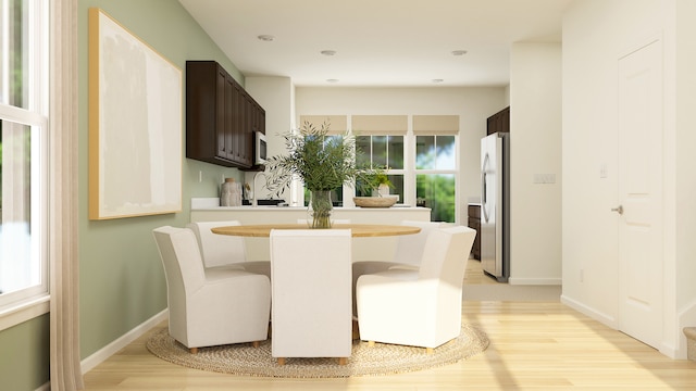 2109 Neubauer Cir, Lindenhurst, IL 60046 - dining space with light wood-style flooring