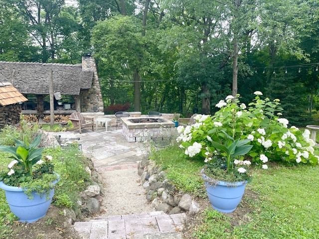 825 Swift Ave, Oglesby, IL 61348 - view of yard with an outdoor fire pit and a patio area
