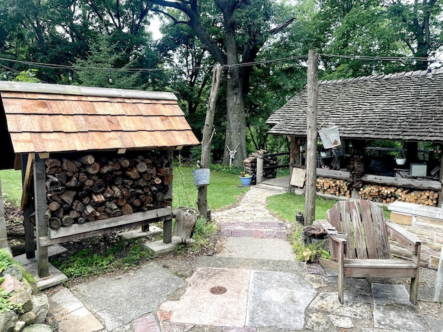 825 Swift Ave, Oglesby, IL 61348 - view of yard featuring a patio area and view of scattered trees