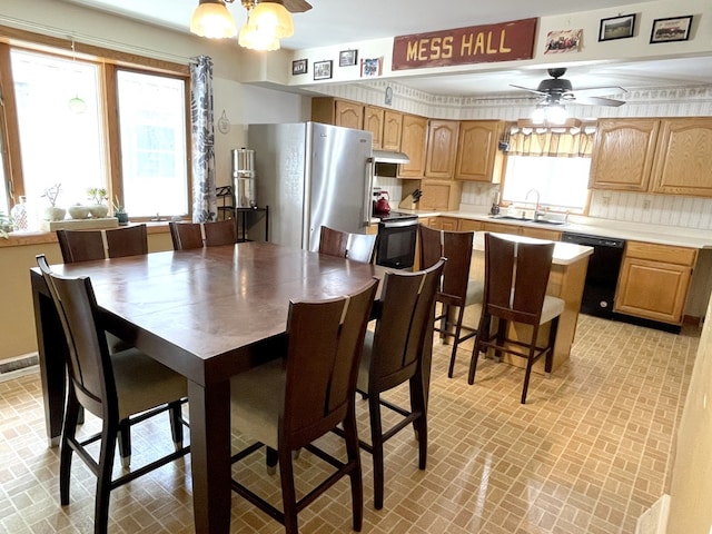 825 Swift Ave, Oglesby, IL 61348 - dining room with brick patterned flooring and a ceiling fan