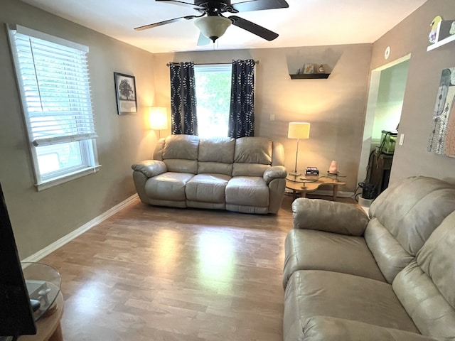 825 Swift Ave, Oglesby, IL 61348 - living area featuring a ceiling fan and wood finished floors