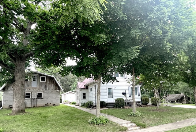 825 Swift Ave, Oglesby, IL 61348 - view of front of property featuring a front yard and an outbuilding