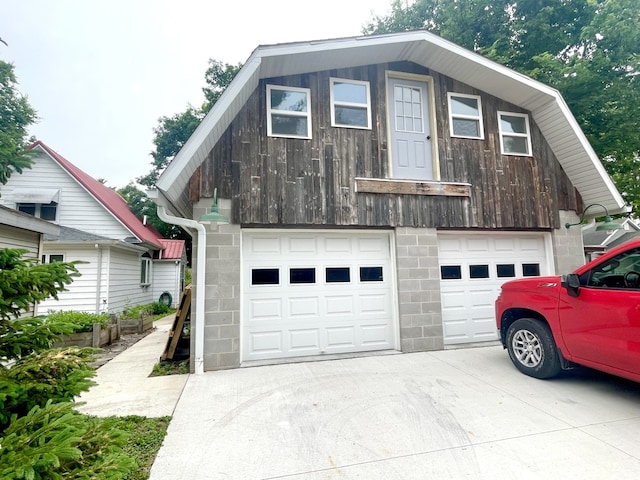 825 Swift Ave, Oglesby, IL 61348 - view of front of home featuring concrete driveway and a detached garage