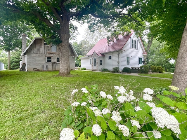 825 Swift Ave, Oglesby, IL 61348 - view of green lawn featuring a barn and an outbuilding
