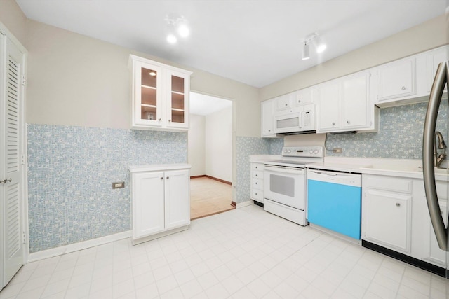 77 Lake Hinsdale Dr Unit 207, Willowbrook, IL 60527 - kitchen with white appliances, light countertops, white cabinetry, glass insert cabinets, and wallpapered walls