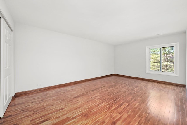 77 Lake Hinsdale Dr Unit 207, Willowbrook, IL 60527 - unfurnished bedroom with wood finished floors and a closet