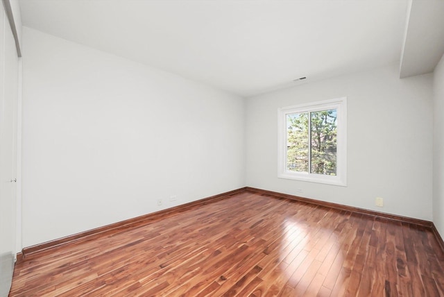 77 Lake Hinsdale Dr Unit 207, Willowbrook, IL 60527 - spare room with wood-type flooring and baseboards