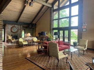 77 Lake Hinsdale Dr Unit 207, Willowbrook, IL 60527 - community lobby featuring high vaulted ceiling and a wooden ceiling with exposed beams