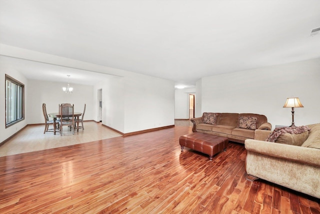 77 Lake Hinsdale Dr Unit 207, Willowbrook, IL 60527 - living room with wood finished floors and a chandelier