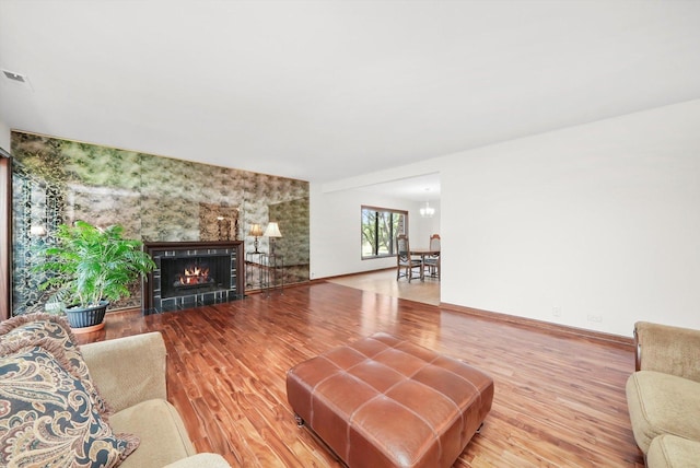 77 Lake Hinsdale Dr Unit 207, Willowbrook, IL 60527 - living area with wood finished floors and a lit fireplace