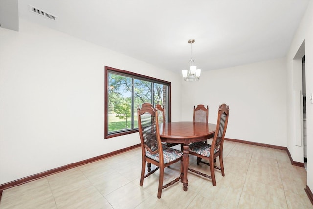 77 Lake Hinsdale Dr Unit 207, Willowbrook, IL 60527 - dining space featuring a chandelier and baseboards