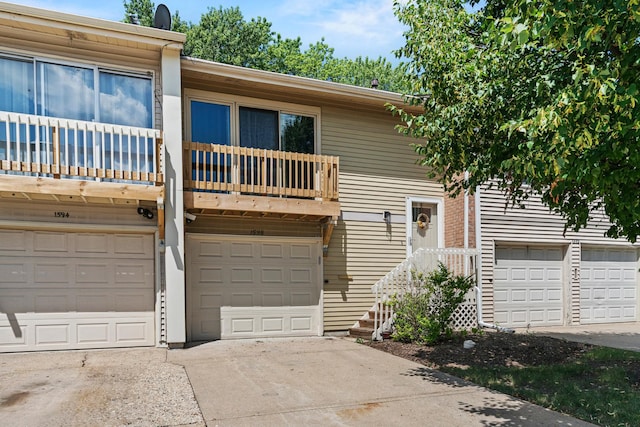 1598 Elder Dr, Aurora, IL 60506 - view of front of home featuring a balcony, a garage, and driveway