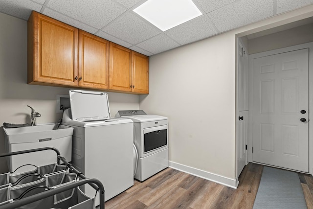 1598 Elder Dr, Aurora, IL 60506 - washroom featuring cabinet space, washing machine and dryer, and wood finished floors