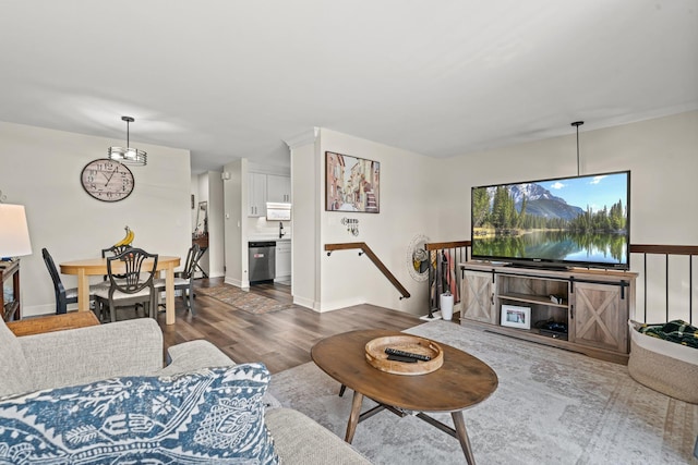 1598 Elder Dr, Aurora, IL 60506 - living area with dark wood-style flooring and baseboards