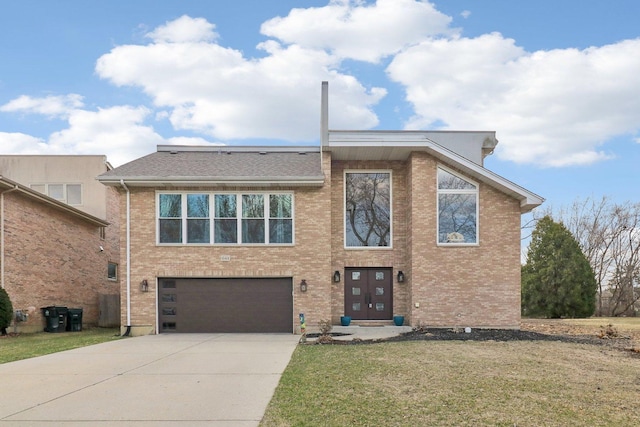 644 N Franklin Ave, Palatine, IL 60067 - view of front of property with concrete driveway, an attached garage, a front lawn, and brick siding
